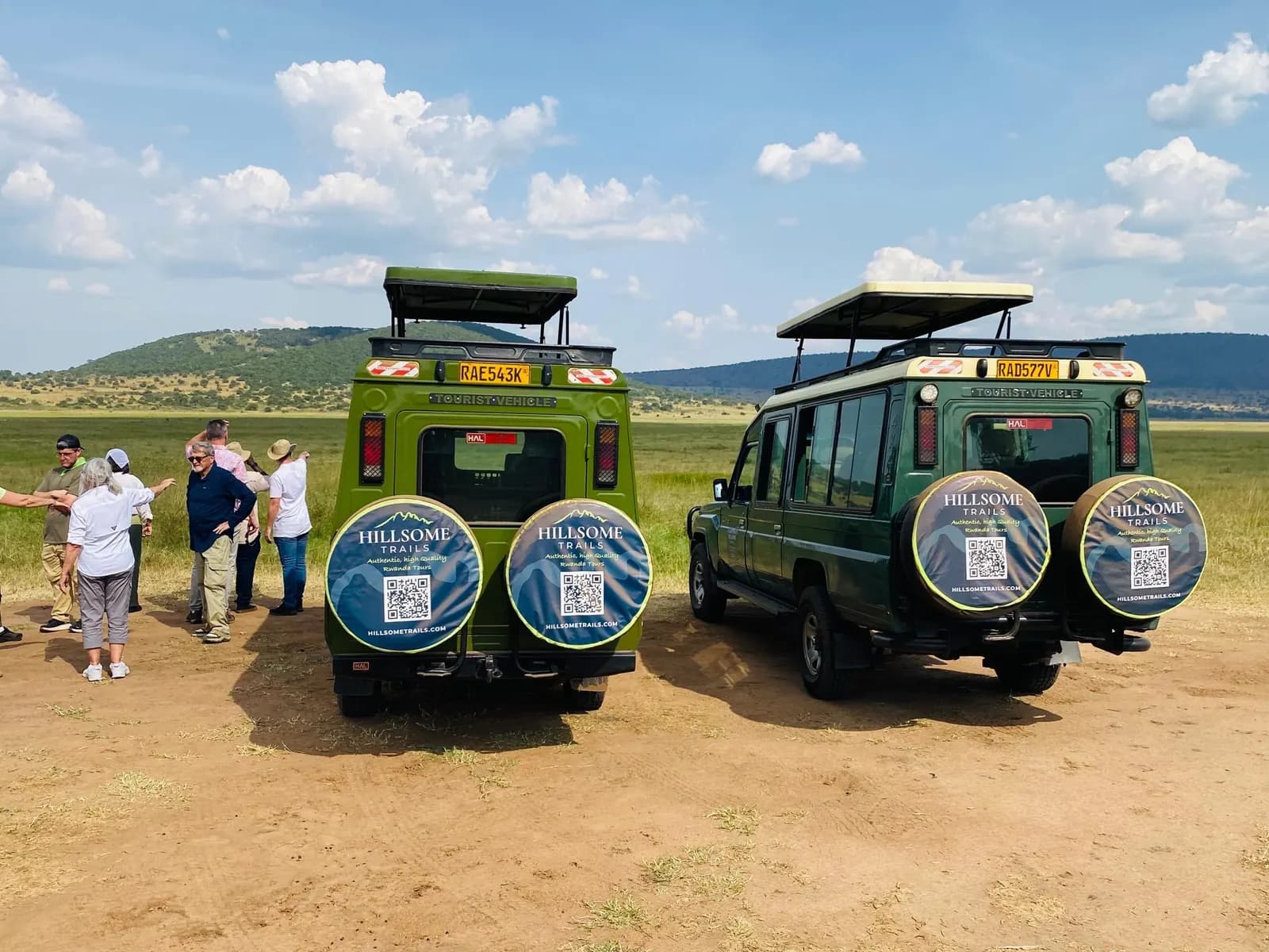 Hillsome Trails safari vehicles on an open savannah track